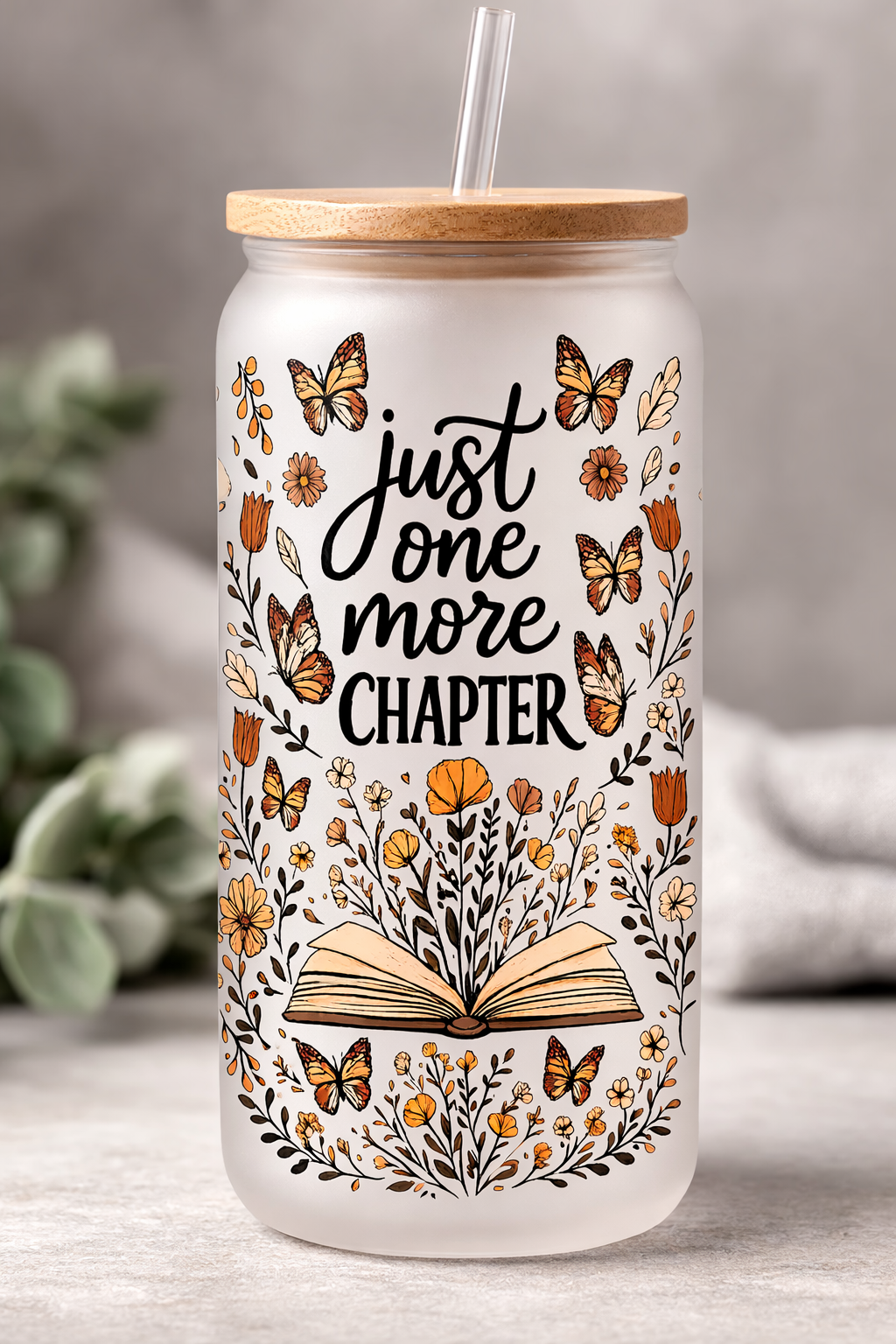 Bookworm themed 16 oz Frosted Glass can with bamboo lid and straw.